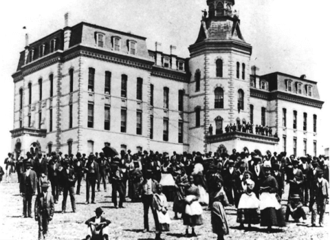 black and white print of Howard university with students in the courtyard